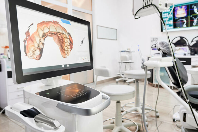 Photo of a CEREC scanner taking a digital impression of teeth.