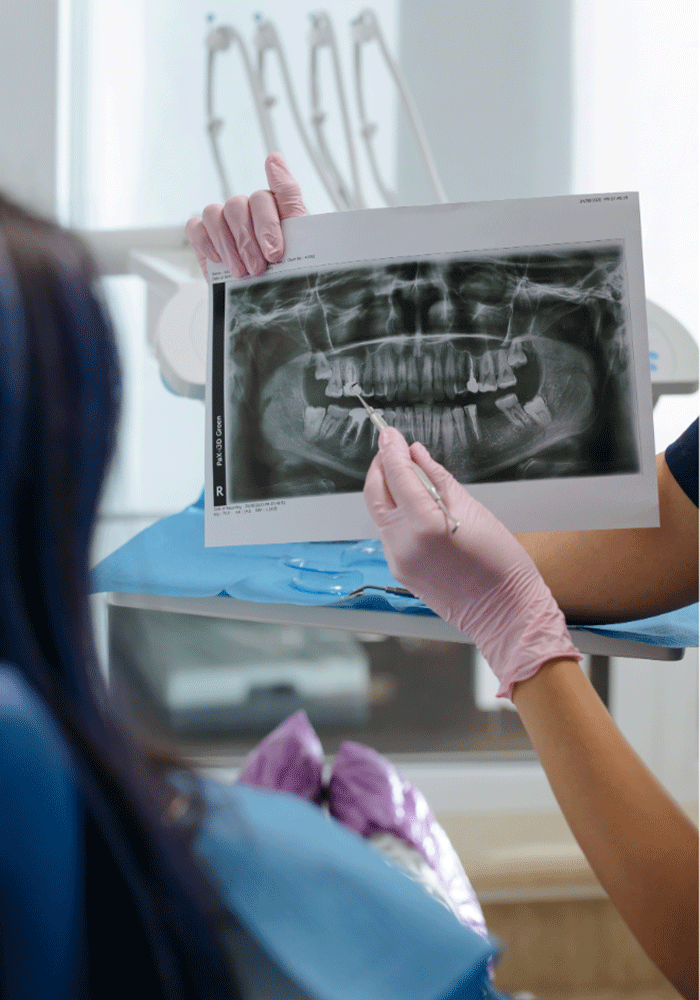 Dentist showing an X-ray to a patient